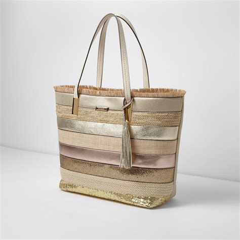 gold metallic stretch fabric tote bag|South Beach metallic tote bag in gold .